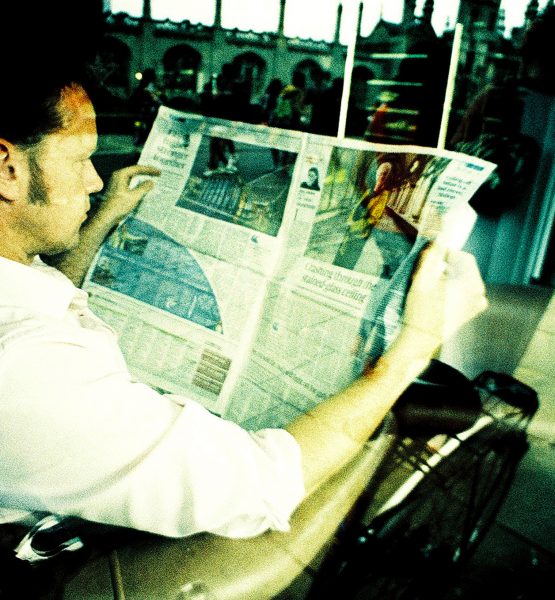 Reading the Newspaper (adapted) (Image by Nick Page [CC BY 2.0] via Flickr)