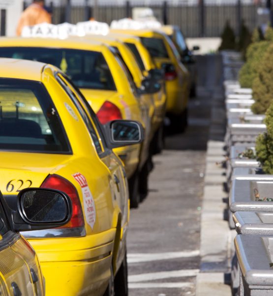 Taxi cabs at Penn Station (adapted) (Image by Marcin Wichary [CC BY 2.0] via Flickr)