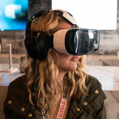 Woman Using a Samsung VR Headset at SXSW (adapted) (Image by Nan Palmero [CC BY 2.0] via Fickr)