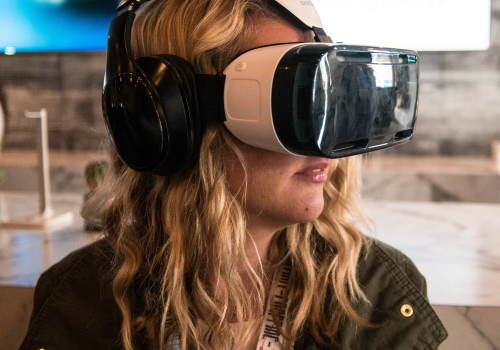 Woman Using a Samsung VR Headset at SXSW (adapted) (Image by Nan Palmero [CC BY 2.0] via Fickr)