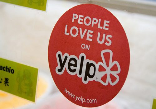Yelp Sticker and Reviews (adapted) (Image by StickerGiant Custom Stickers [CC BY 2.0] via Flickr)