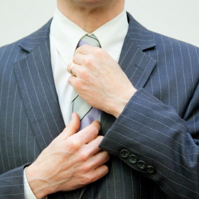 Individual in a Suit (adapted) (Image by Flazingo Photos [CC BY-SA 2.0] via Flickr)