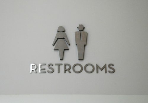 Restrooms (adapted) (Image by Sam Howzit [CC BY 2.0] via flickr)