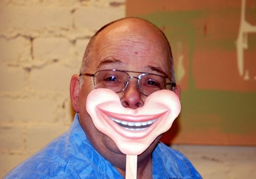 Neil smiles (adapted) (Image by Cassandra Rae [CC BY 2.0] via Flickr)