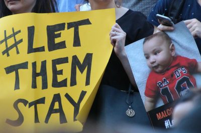Yellow sign - Sanctuary rally #LetThemStay Melbourne (adapted) (Image by Takver [CC BY-SA 2.0] via flickr)