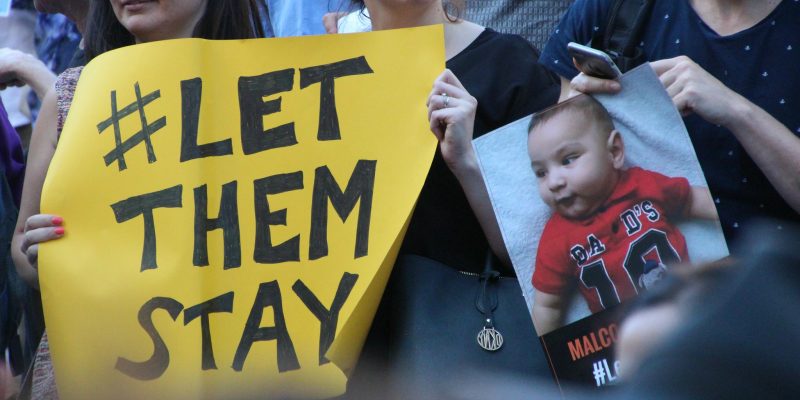 Yellow sign - Sanctuary rally #LetThemStay Melbourne (adapted) (Image by Takver [CC BY-SA 2.0] via flickr)