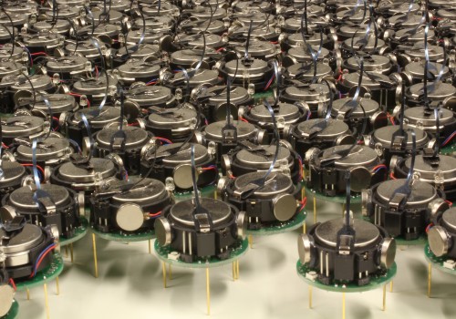 Kilobot Robot Swarm (Image by asuscreative [CC BY SA], via Wikimedia Commons)