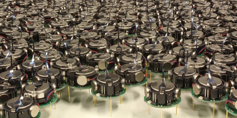 Kilobot Robot Swarm (Image by asuscreative [CC BY SA], via Wikimedia Commons)