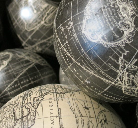 Globes (adapted) (Image by Jayel Aheram [CC BY 2.0] via flickr)