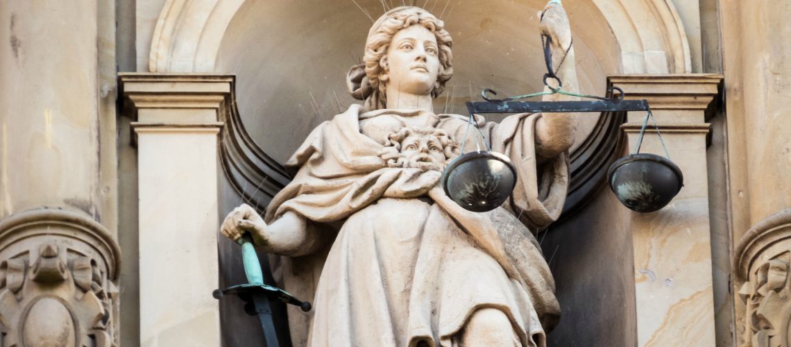 Justitia (adapted) (Image by Markus Daams [CC BY 2.0] via Flickr)