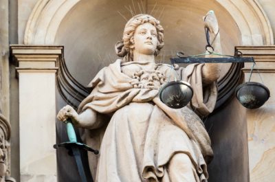 Justitia (adapted) (Image by Markus Daams [CC BY 2.0] via Flickr)