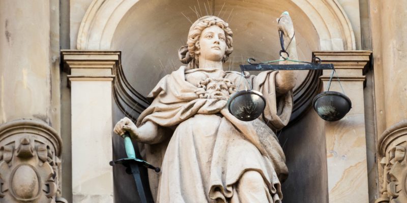 Justitia (adapted) (Image by Markus Daams [CC BY 2.0] via Flickr)