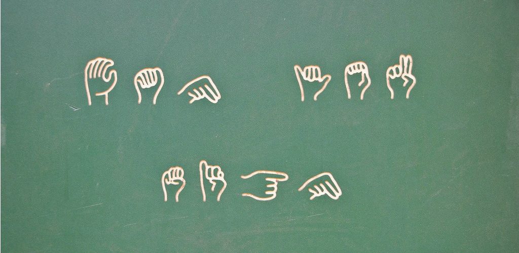 Learn sign language at the playground (adapted) (Image by Valerie Everett [CC BY-SA 2.0] via Flickr)
