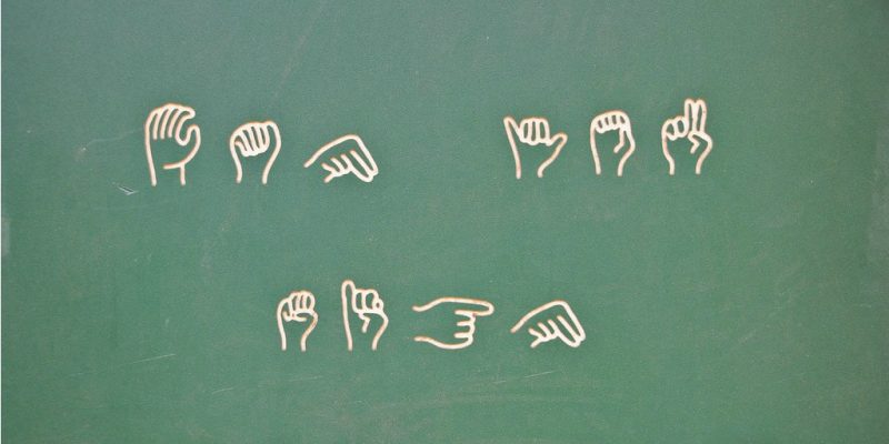 Learn sign language at the playground (adapted) (Image by Valerie Everett [CC BY-SA 2.0] via Flickr)