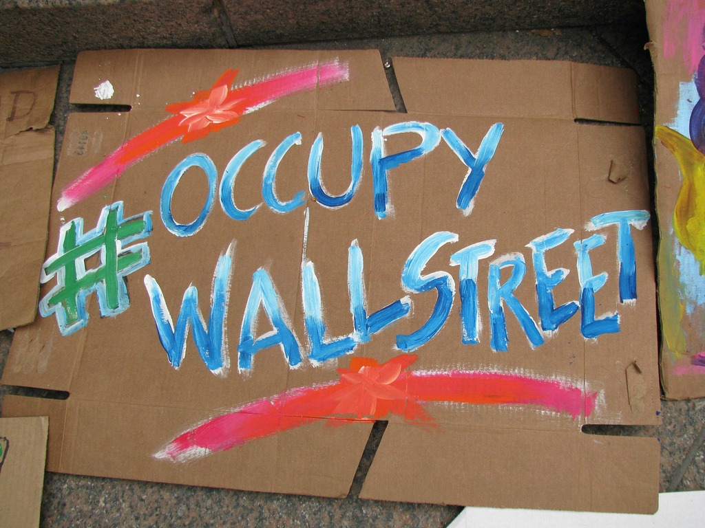 Occupy Wall Street (adapted) (Image by Eden, Janine and Jim [CC BY 2.0] via flickr)