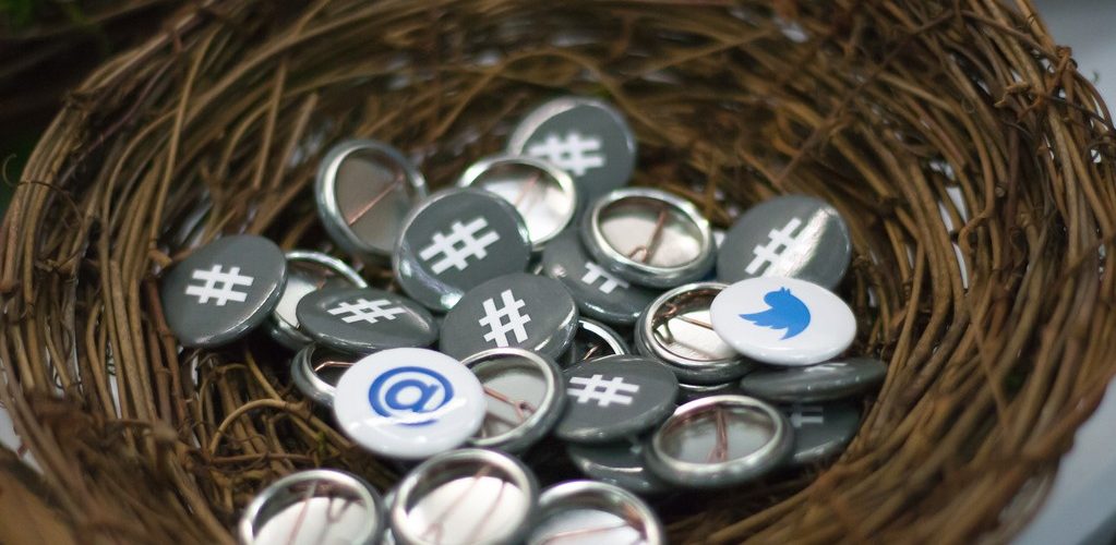 Twitter Buttons at OSCON adapted) (Image by Garrett Heath [8CC BY 2.0], via flickr)