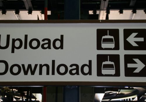 Upload - Download (adapted) (Image by John Trainor [CC BY 2.0] via Flickr)
