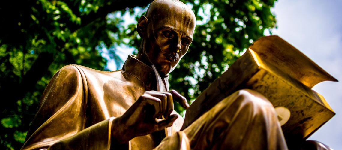 Statue of man reading (adapted) (Image by Carl Cerstrand [CC0 Public Domain] via Unsplash)