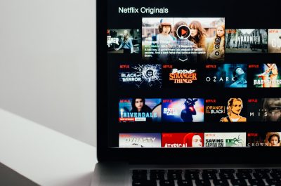 Browsing Netflix Streaming (adapted) (Image by Charles Deluvio [CC0 Public Domain] via Unsplash)