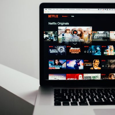 Browsing Netflix Streaming (adapted) (Image by Charles Deluvio [CC0 Public Domain] via Unsplash)