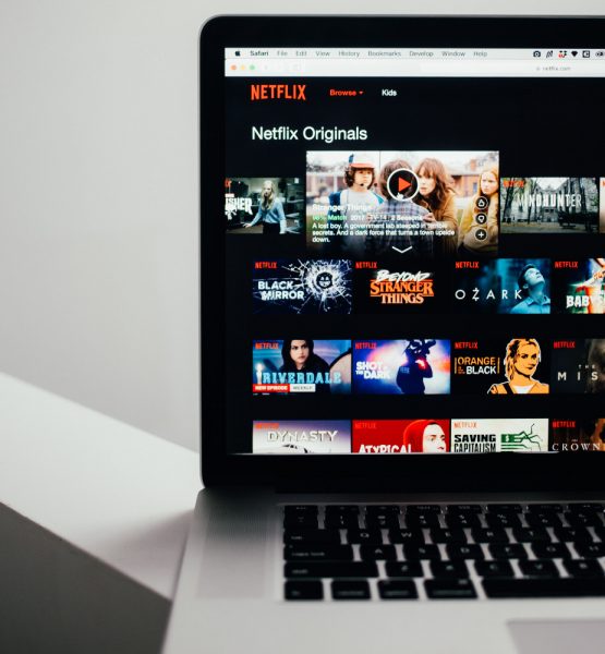 Browsing Netflix Streaming (adapted) (Image by Charles Deluvio [CC0 Public Domain] via Unsplash)