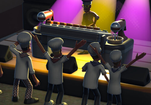 Eine Kochstudenten mit Kochmützen genießen das Konzert eines DJs, der ebenfalls mit Kochmütze auf der Bühne steht.