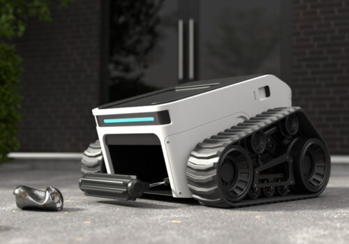 Ein Roboter fährt über einen Gehweg und sammelt über eine Luke herumliegenden Müll auf.