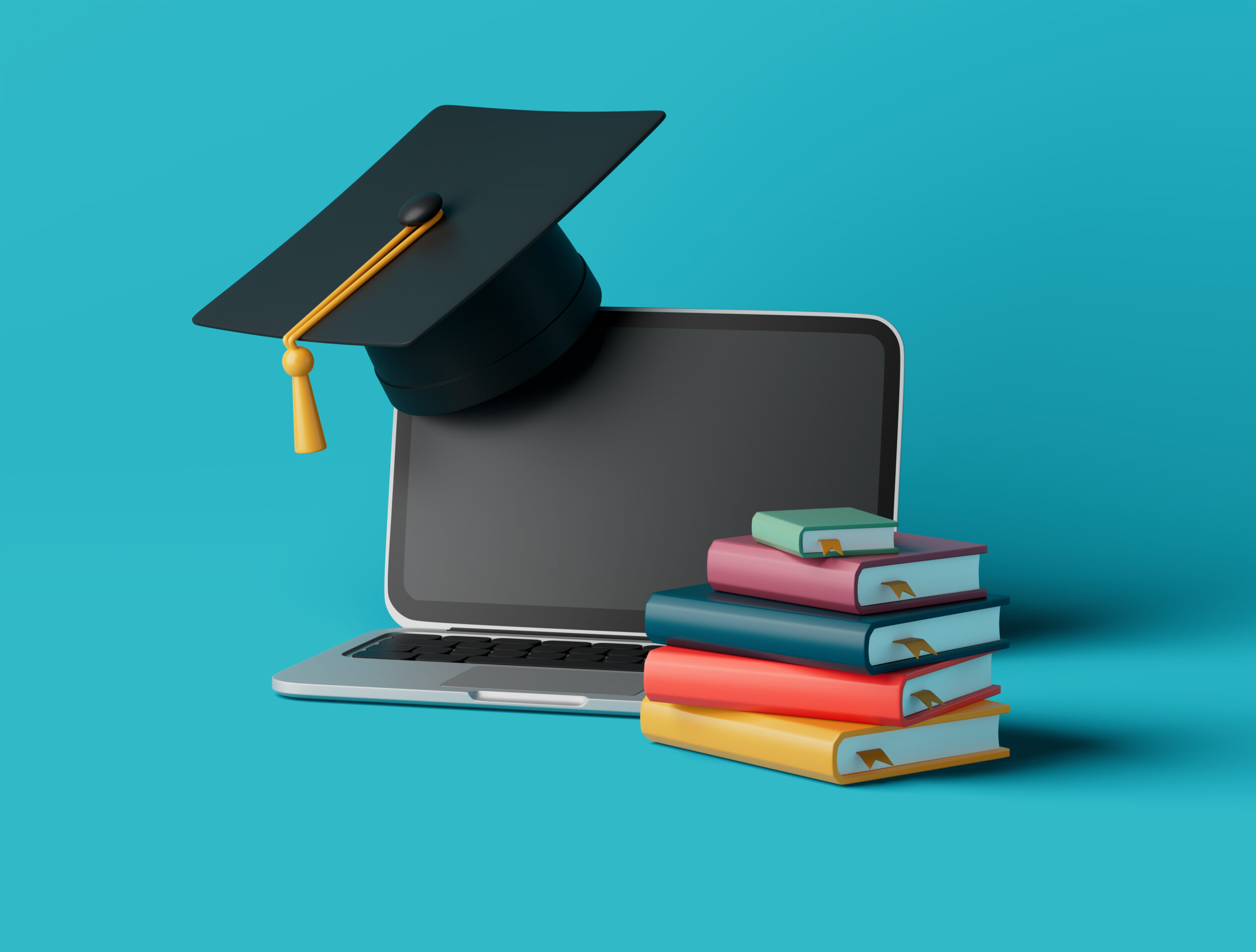 Buchstapel mit Laptop und Diplom-Hut