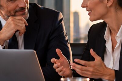 business people talking on a desk