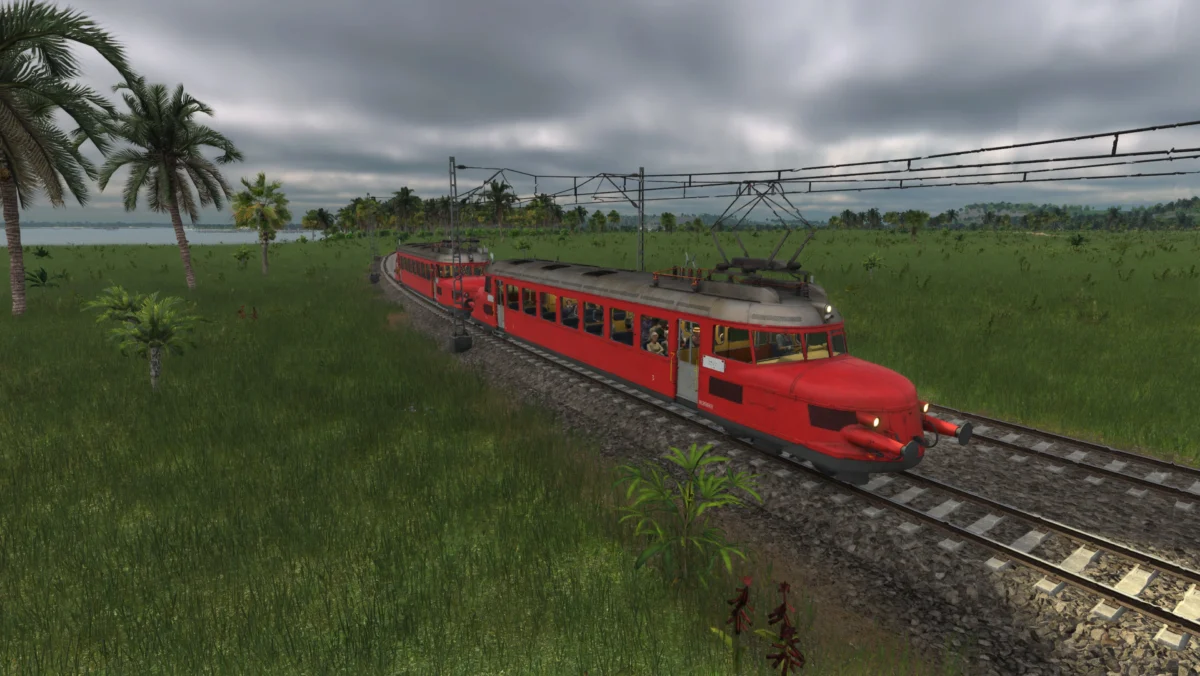 Der ikonische Zug "Roter Pfeil" saust durch eine tropische Landschaft.
